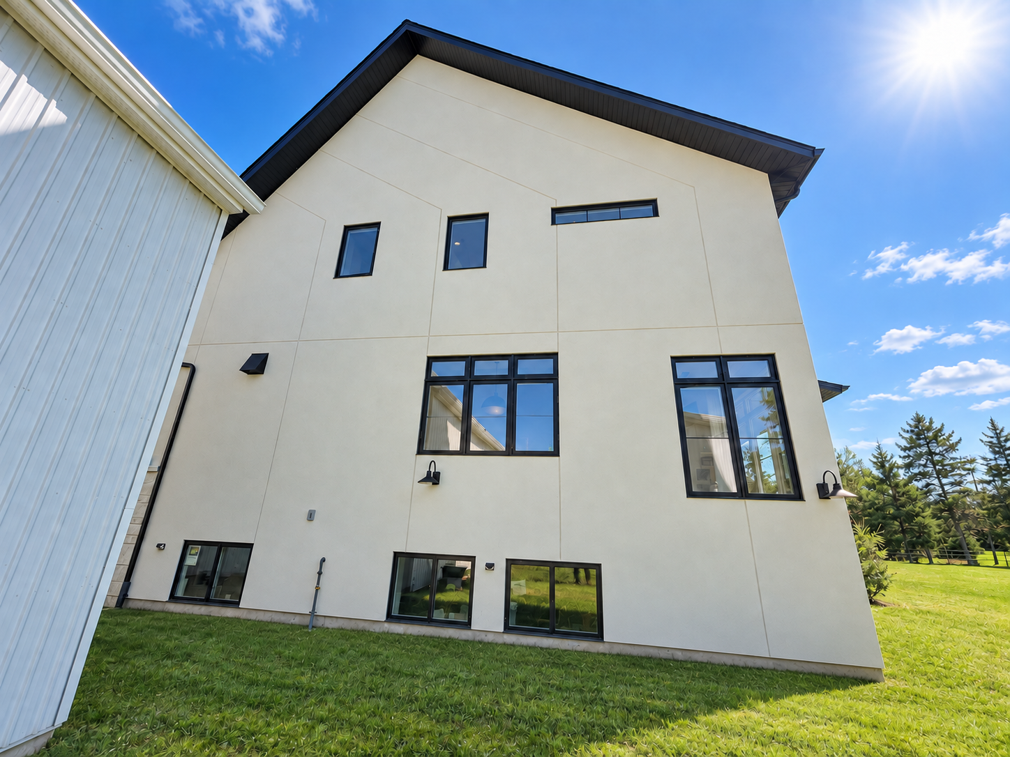 Side exterior with tall windows and basement windows